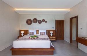 Ένα ή περισσότερα κρεβάτια σε δωμάτιο στο Ikada Villa by GenuineHost +10 φωτογραφίες