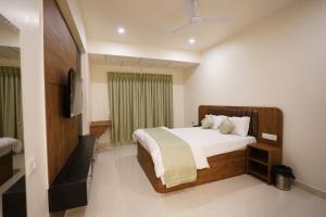 Postel nebo postele na pokoji v ubytování DrizzleDrop Inn Chennai + 37 fotografií
