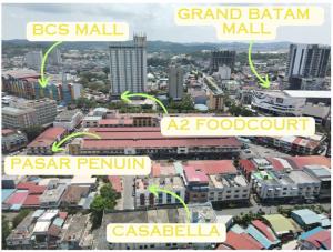 a group of buildings in a city with green arrows at Casabella 101 A2 Grand Batam Penuin Wet Market in Nagoya