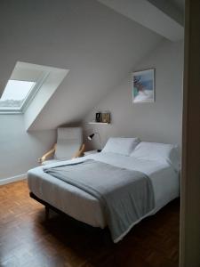 a bedroom with a large bed and a window at Suite Ribadesella VUT2191AS in Ribadesella