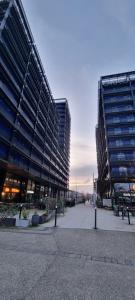 a large building with two tall buildings in a city at BEL APPARTEMENT CONTEMPORAIN avec TERRASSE CLIMATISATION et PARKING payant en option in Strasbourg