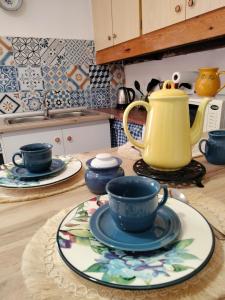 a table with a tea pot and plates on it at Casa Celia in Miranda del Rey +34 photos