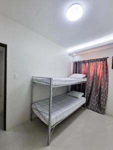 Ένα ή περισσότερα κρεβάτια σε δωμάτιο στο Millenia Oaks Apartments 2