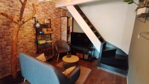 Posezení v ubytování La Roche Blanche, maison de bourg pleine de charme