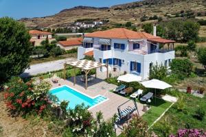 an aerial view of a house with a swimming pool at Thalassa Home Comfort in Petra