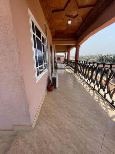 an empty balcony of a house with a balcony at Shirley’s Corner in Kumasi