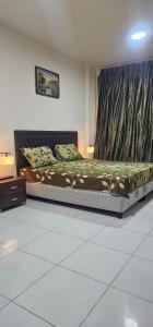 a bedroom with a bed in a room at Fully Furnished Studio Appartment next to Sharaf DG metro Station in Dubai