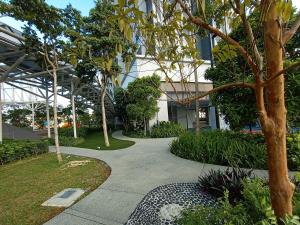 a walkway in front of a building at Trion KL Sweet Grace X TRX Sky Tower in Kuala Lumpur