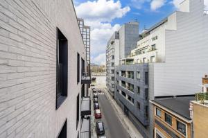 an aerial view of a city street between buildings at L'appart Baobab, avec sauna in Liège