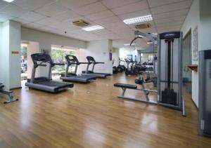 a gym with several tread machines in a room at Acuk Stay - Seri Maya Condo Homestay in Kuala Lumpur