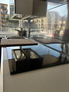a glass table in a room with a view of a city at The Attic Apartment in Rome