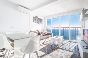a living room with a view of the ocean at Las Damas 23-C Levante Beach in Benidorm