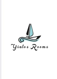 a sailboat on a wave in the ocean at Yialos Rooms in Piso Livadi