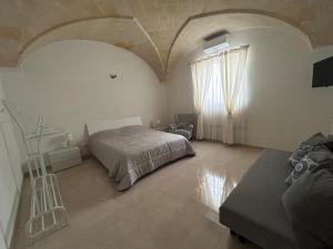 Säng eller sängar i ett rum på Angolo Jonico