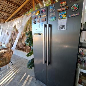 a stainless steel refrigerator in a kitchen at Casa Juan Farm in Candelaria
