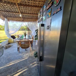 a kitchen with a refrigerator and a table with chairs at Casa Juan Farm in Candelaria