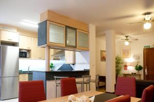 a kitchen and living room with a table and chairs at APARTAMETO BAZTANGOA I in Elizondo