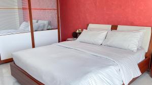 Postel nebo postele na pokoji v ubytování Beach House Roccalumera