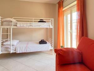Postel nebo postele na pokoji v ubytování Beach House Roccalumera
