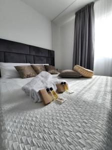 a bedroom with a bed with two boxes on it at Il Canto Di Iside in Marsala