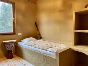 Llit o llits en una habitació de Das Haus am See - der idyllische Privatsee nahe Wien
