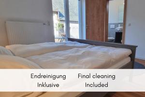 an image of a bed in a room at Terrasse der Ruhe im Alten Winzerhaus am Calmont in Bremm +22 photos