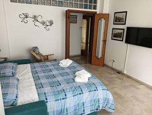 Postel nebo postele na pokoji v ubytování Don Alfonso Apartaments