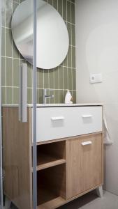 a bathroom with a sink and a mirror at La Higuera ATCC00793 in Trujillo