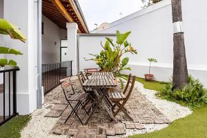 a patio with two chairs and a table at artQhost Jerez Huge Loft & Free Parking in Jerez de la Frontera