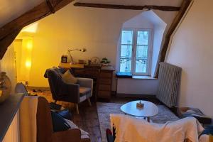 a living room with a couch and a table at Appartement Intra murailles in Vannes