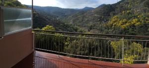 a balcony with a view of a mountain valley at Studio au coeur de l'Esterel à Théoule-sur-Mer in Théoule-sur-Mer