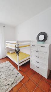 מיטה או מיטות בחדר ב-Rota do Viajante