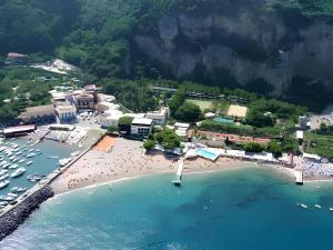 an aerial view of a beach with boats in the water at Casa Relax nel centro storico con posto auto in Vico Equense