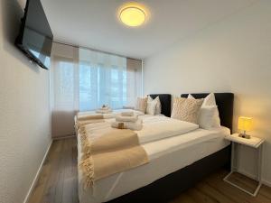 Katil atau katil-katil dalam bilik di 3 Zimmer Apartment, 90 qm, ruhig und zentrumsnah, max 6 Pers, 15 qm Balkon , private Garage, Internet 1000 MBit