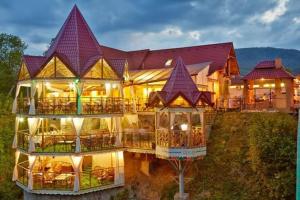 a large building with a lot of balconies at Під горою in Sheshory