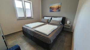 Postel nebo postele na pokoji v ubytování Apartments Erdgeschoss Villa Casper