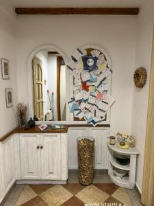 a bathroom with a sink and a mirror and a counter at Kahwa Apartments in Budapest