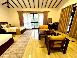 Voodi või voodid majutusasutuse Sigiriya Cashew Palace Resort toas