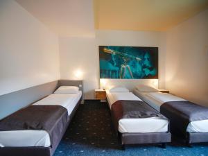 Voodi või voodid majutusasutuse B&B Hotel Jena toas +28 fotot
