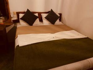 En eller flere senge i et værelse på Sunrise Udawalawe Resort