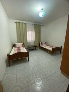 Postel nebo postele na pokoji v ubytování Tota apartments