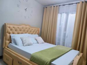 Postel nebo postele na pokoji v ubytování VillaHermia Staycation Cebu