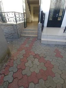 a tiled floor in a building with a staircase at Appartement luxueux de Bonaberi in Douala