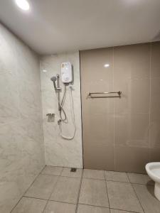 a shower stall in a bathroom with a toilet at East Ville-45 in Ban Hua Khao Sammuk