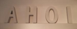 a white sign that says ahdir on a wall at Harksen Hüs in Klixbüll +26 photos