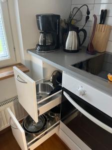 a kitchen with a sink and a coffee maker at 3h + k Golfkentän vieressä in Vantaa