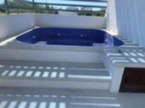 a blue object is sitting inside of a dishwasher at Casa Jacome in Acapulco