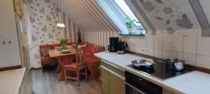 a kitchen with a stove and a counter top at Ferienwohnung Landmann in Winsen