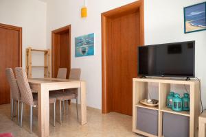 TV a/nebo společenská místnost v ubytování Casa malacala