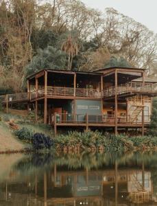 a large house on the shore of a body of water at Viva Brotas in Brotas